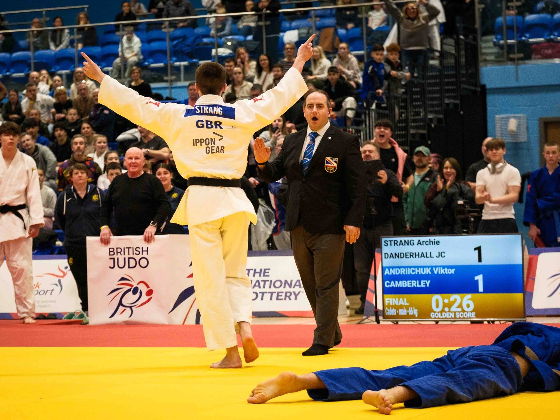 Finlay Strang celebrating a win at the British Champs as David Reilly watches on.