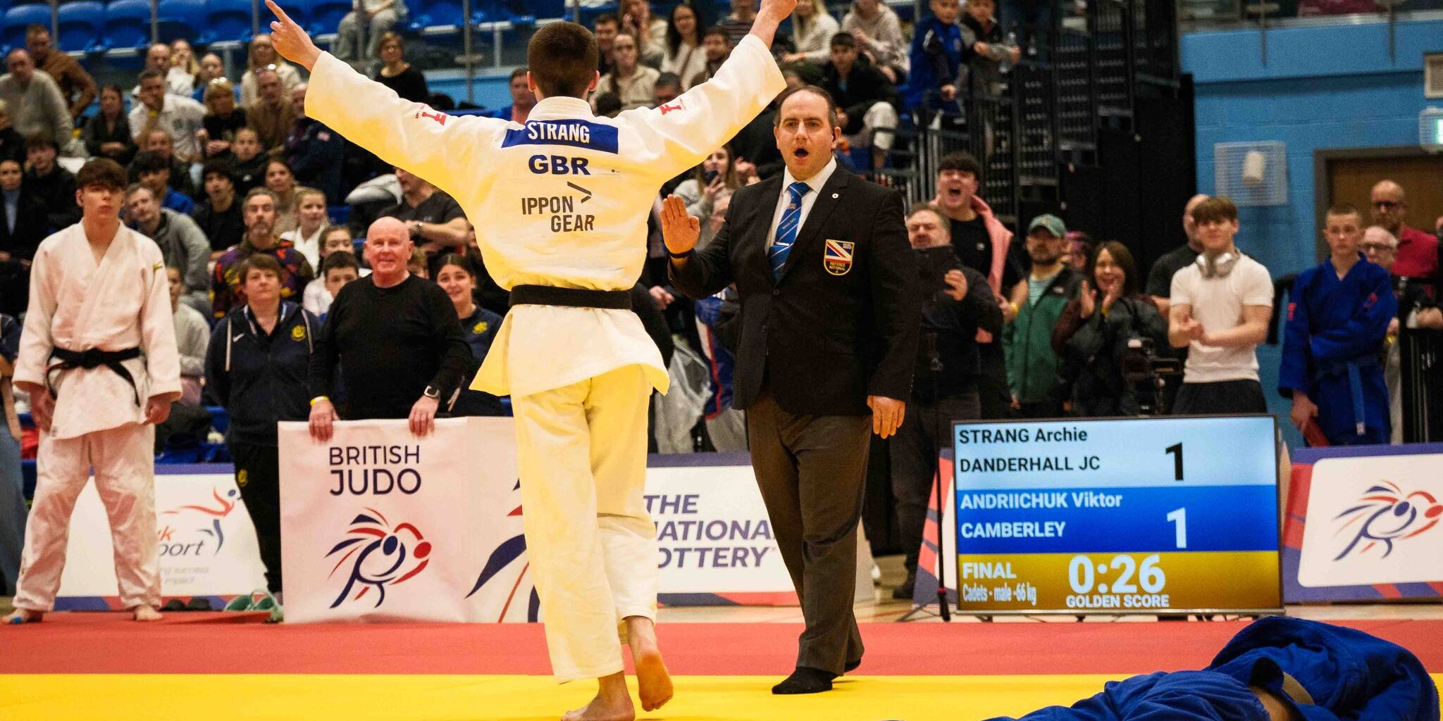 Finlay Strang celebrating a win at the British Champs as David Reilly watches on.